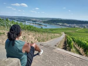 star williams sitting down,l ooking down at view in rudesheim, Germany, on avalon envision river cruise