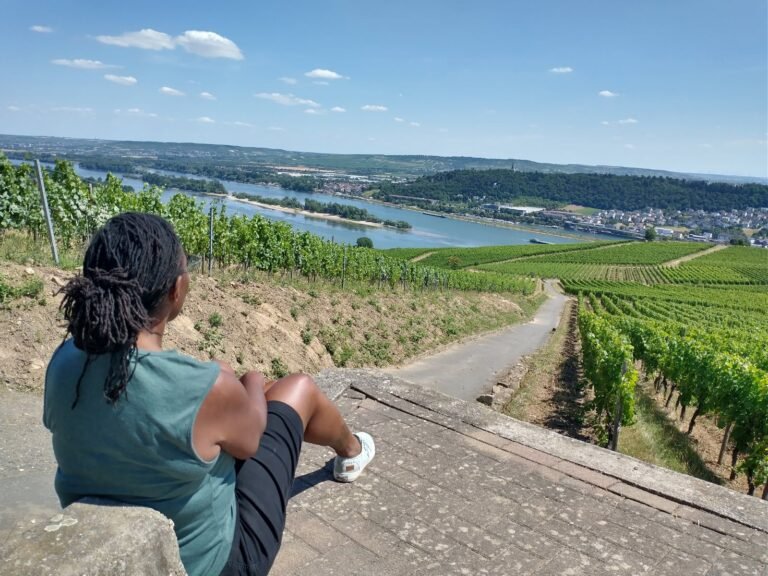 star williams sitting down,l ooking down at view in rudesheim, Germany, on avalon envision river cruise